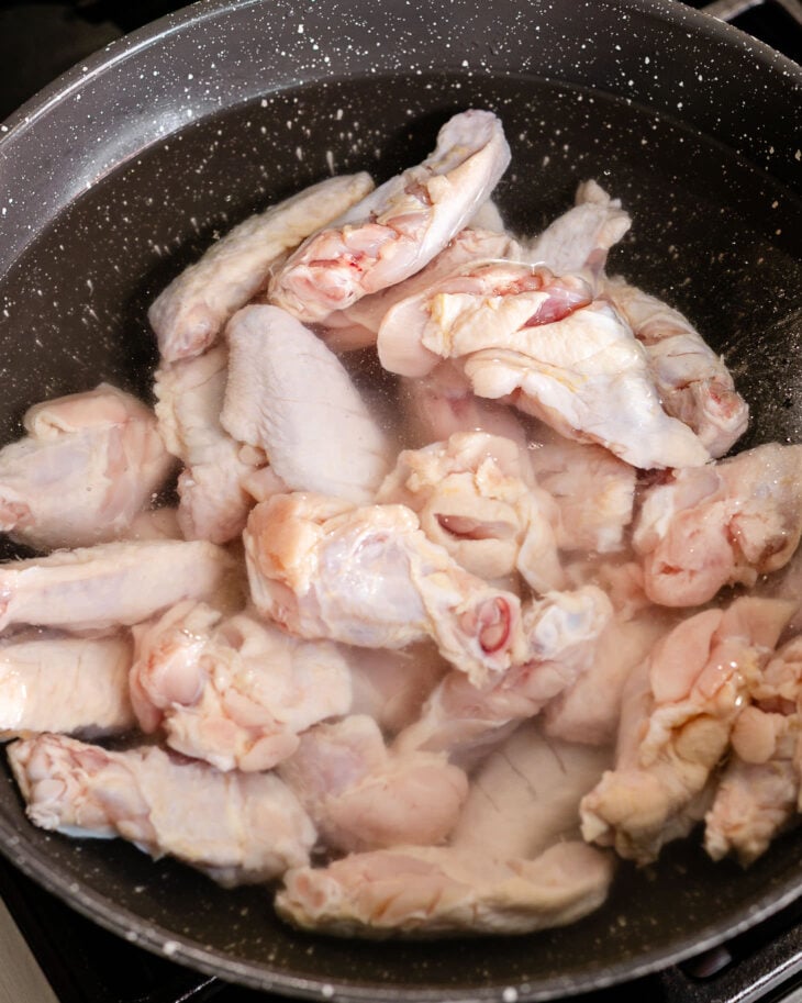 Place the wings in a pot filled with water and bring it to a boil.