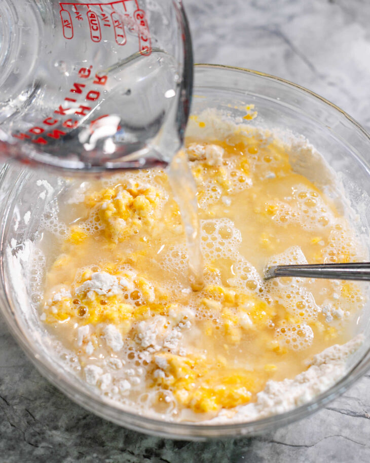 Slowly pour in the water and whisk as you go.