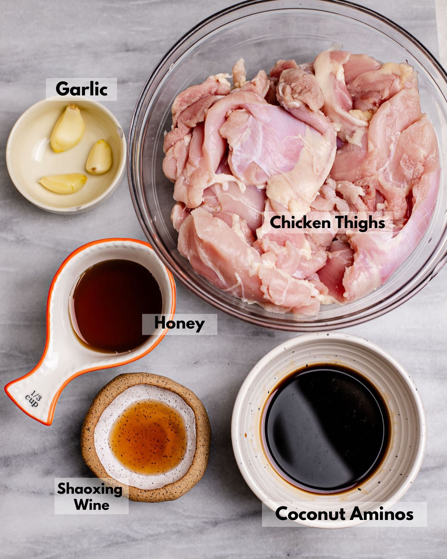 Ingredients for Chinese all purpose marinade. This recipe includes garlic, honey, coconut minos, Shaoxing wine.