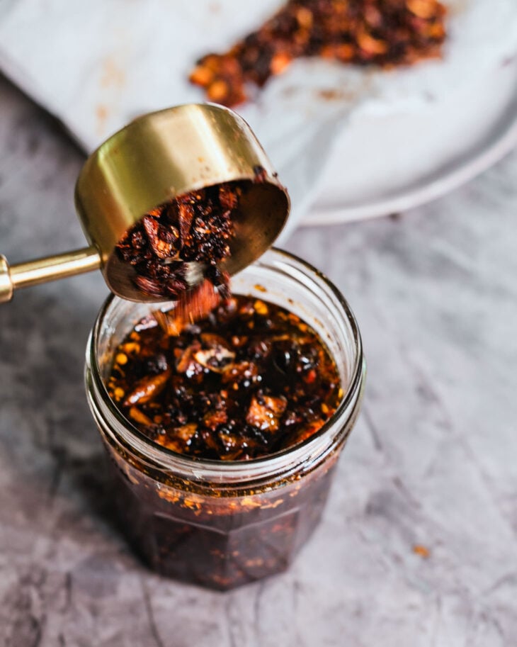 Finally, stir some of those crispy garlic and shallot pieces back into the chili oil before storing.