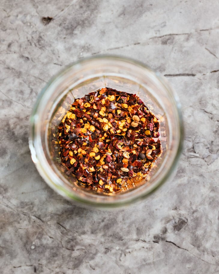 Meanwhile, combine the chili flakes, sugar, salt, and coconut aminos in a heatproof jar.