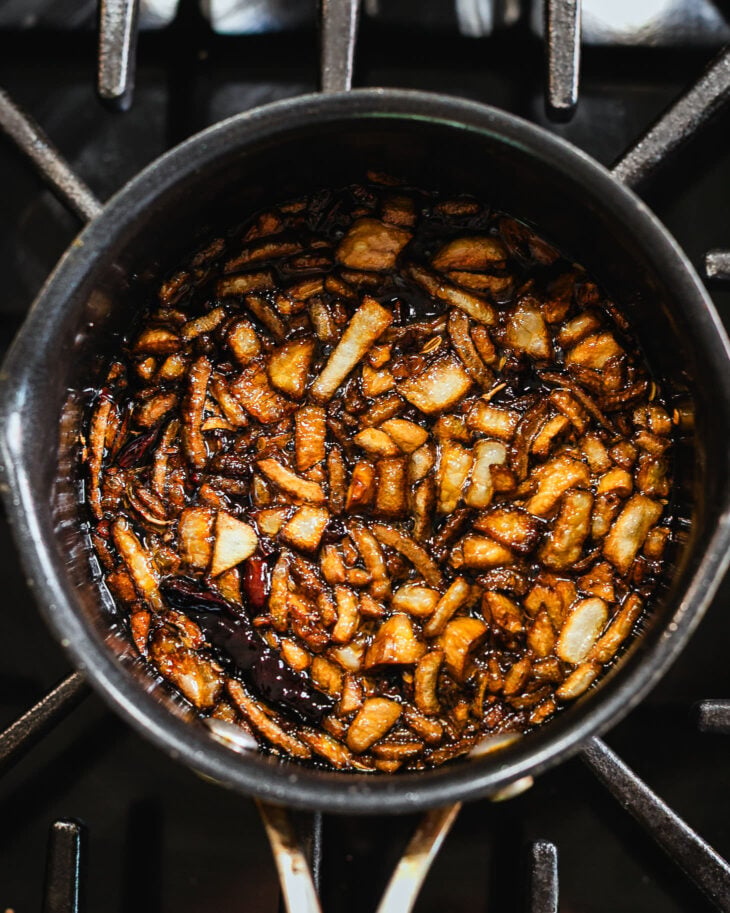 Cook until the garlic and shallots become golden brown and crispy