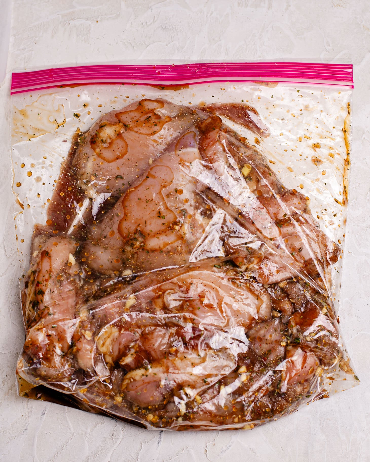 A ziploc bag of chicken in this easy Asian marinade. It has coconut aminos, honey, Shaoxing wine, minced garlic.