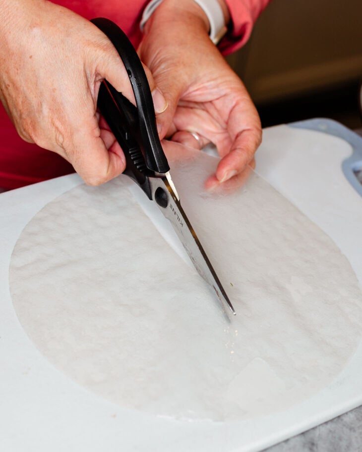 Cut it in half immediately (once it softens completely, it becomes hard to cut)