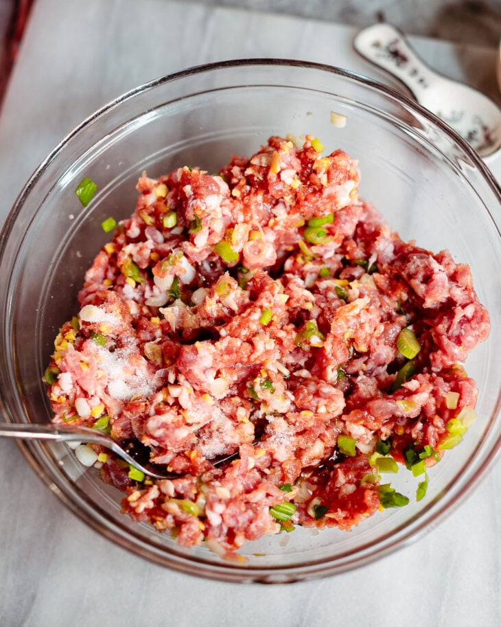 Mix in coconut aminos (or soy sauce), Shaoxing wine, sesame oil and salt.