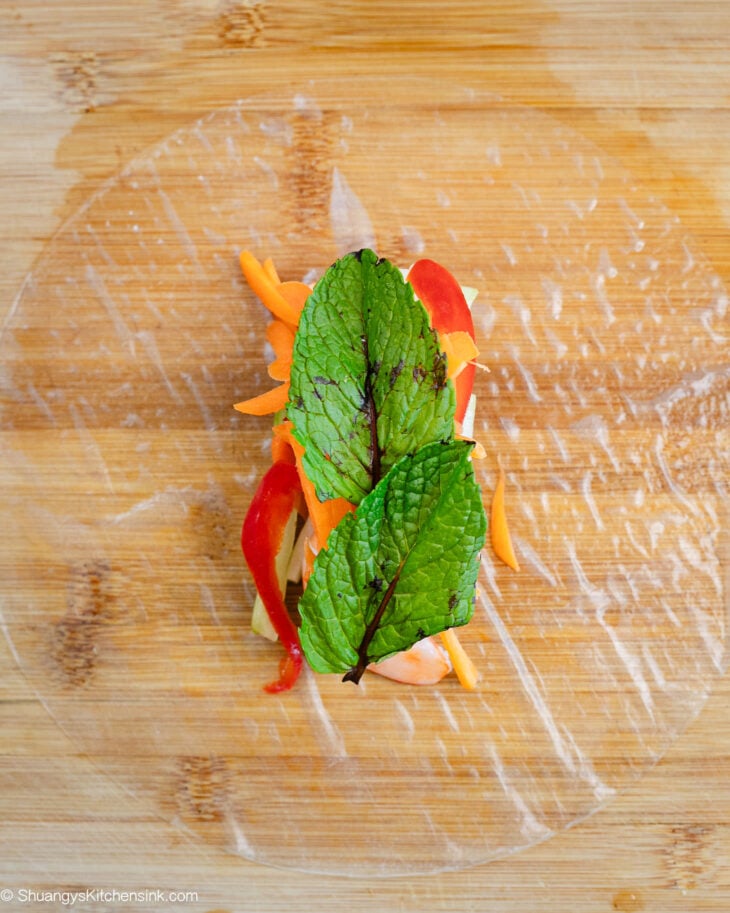 Followed by the bell peppers, carrots, cucumbers, and fresh mint.