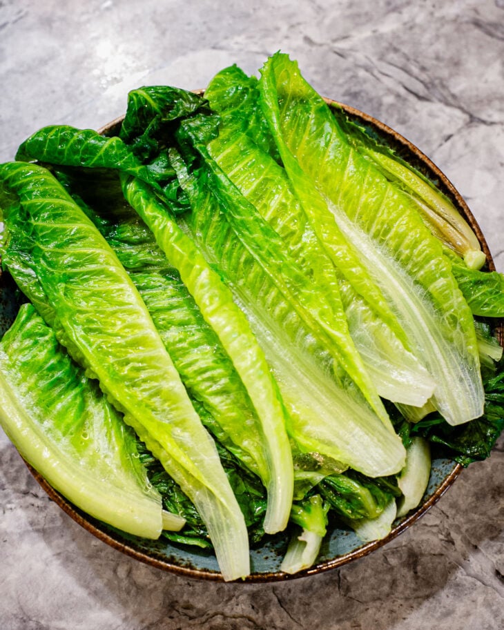 Blanched romaine leaves arranged on a plate